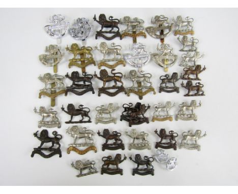 A quantity of Hereford Regiment and Hereford Light Infantry metal insignia