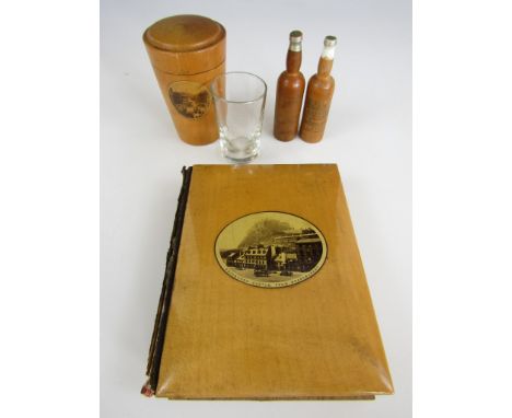 A quantity of 19th Century Mauchline ware, including a carte-de-visite album with a view of Edinburgh Castle from Grassmarket