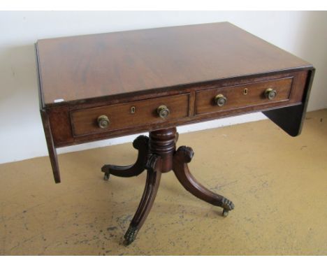 A George IV mahogany sofa table, the top incorporating opposed pairs of respectively false and real cock-beaded drawers with 