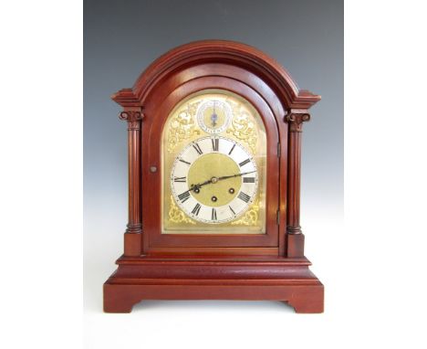 A late 19th Century mahogany cased bracket type clock, with three train movement by Gustav Becker, the arched face having a s