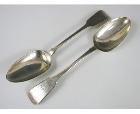 Two harlequin George IV Irish silver table spoons, of fiddle rat-tail pattern with an armorial crest to the terminals, Willia