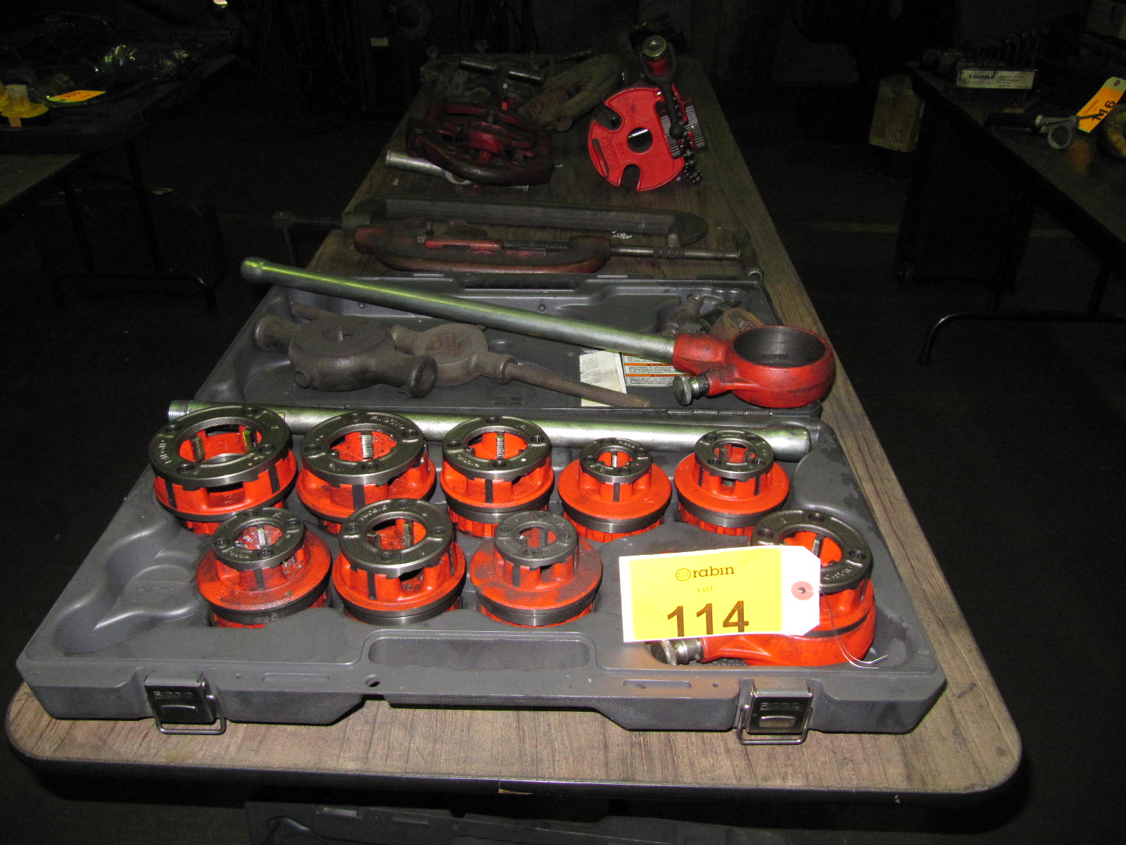 Ridgid manual pipe threader with (12) heads, (4) pipe cutter, and (1
