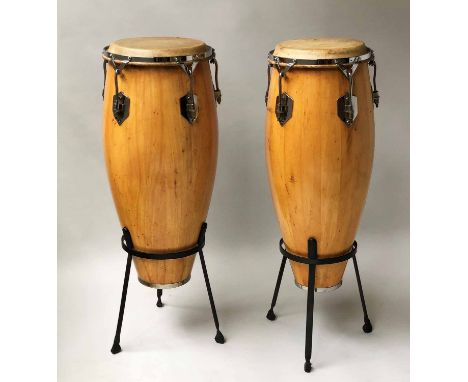 BONGO DRUMS, two vintage similar, stretched skin on metal stands, 97cm H. (2)