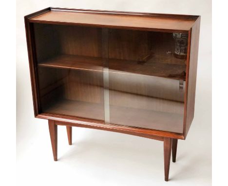 BOOKCASE, 1970's teak with glazed doors adjustable shelf and tapering supports, 92cm H x 92cm x 30cm.