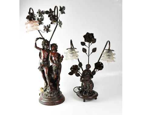 A figural spelter lamp base modelled as a young couple, with frosted glass shade (one shade missing), height 76cm and a simil