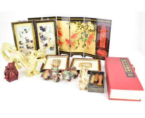 A mixed collectors' lot of Oriental themed items, comprising two ceramic dogs of Fo, a red lacquered Buddha, three resin wise