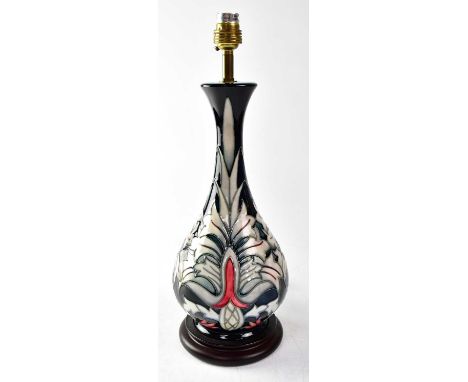 MOORCROFT; a lamp in the 'Snakeshead' design, on a circular wooden base, height including fitment 41cm.Condition Report: - Th