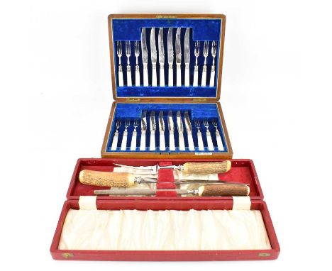 A cased twenty-four piece mother of pearl silver plated dessert knife and fork set, together with a cased stag horn handle th