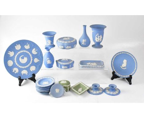 WEDGWOOD; a quantity of mainly light blue jasperware to include a 10th Anniversary Christmas plate, 1978, pin dishes, candles