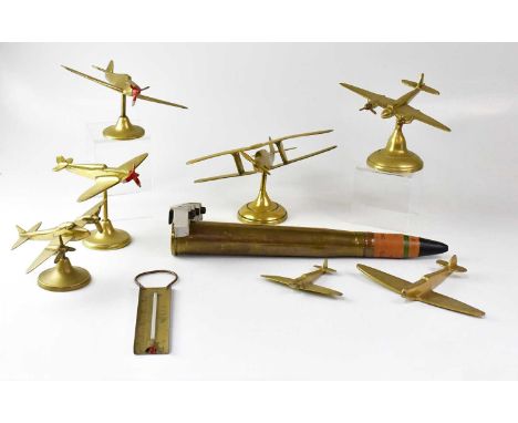 A brass model of a Spitfire on stand to spreading circular foot, height 16cm, a further model Spitfire lacking propeller and 