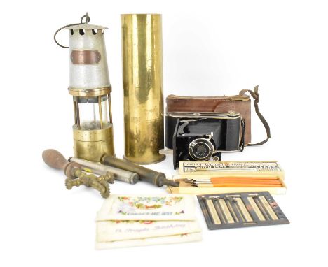 A collectors' lot to include a brass artillery shell, 28 x 8cm, a miners' safety lamp, a box of William Witchell's 'Witch' pe