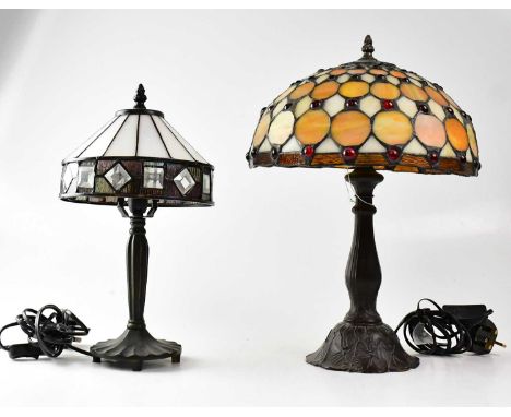 A Tiffany-style leaded and stained glass table lamp on embossed metal column, together with one other stained glass table lam