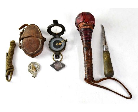 A WWI military issued pocket compass with silvered dial, stamped with the Board of Ordnance broad arrow above '51309', in lea