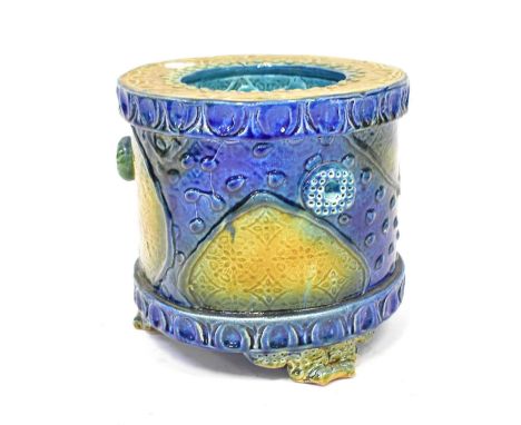 RAYMOND POWER; a ceramic planter in the Majolica style, embossed with naturalistic motifs to the exterior and turquoise inter
