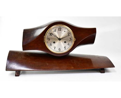 An unusual eight-day mantel clock fashioned from a mahogany propeller, fitted with 5.5 inch silvered dial set with Arabic num