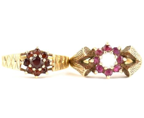 Two 1970s 9ct gold ruby cluster rings, one with central claw set white opal, both with textured shoulders, size L and N, comb