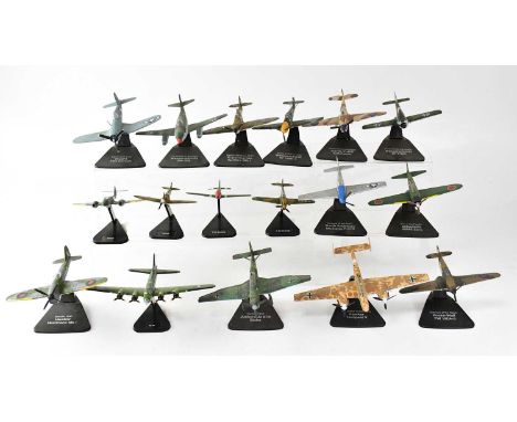 A quantity of painted cast metal scale models of military aircraft on black plastic stands (part af).