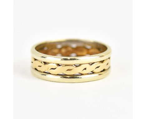 A 9ct gold two-colour band ring, the open central band with Celtic pattern flanked by white gold, size M, approx. 4g.