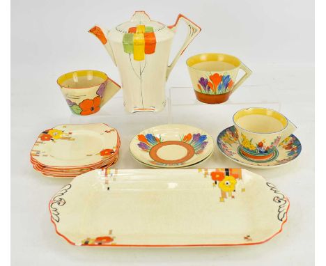 Various Art Deco ceramics comprising a Clarice Cliff 'Crocus' pattern teacup with triangular handle, height 7cm, and two sauc