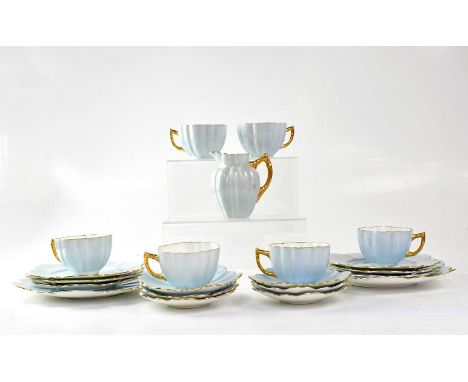 AYNSLEY; a pale blue and gilt-heightened petal-shaped tea set comprising six cups and saucers, a milk jug, six side plates an