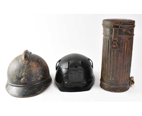 A WWII German M30 gas mask with FE41 filter in original tin, a WWI period French M15 infantry helmet and a Hugh Wood &amp; Co