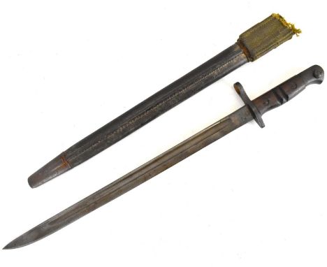 REMMINGTON; a WWI 1913 pattern bayonet, dated 16/2/1913, with relevant markings and leather scabbard.