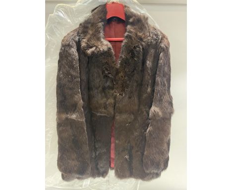 A ladies Rabbit fur coat size 12 