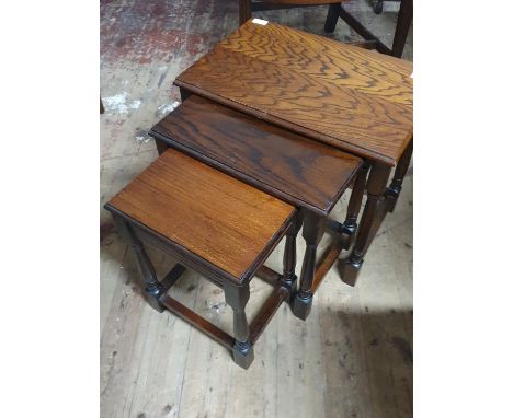 A vintage nest of three tables, shipping unavailable