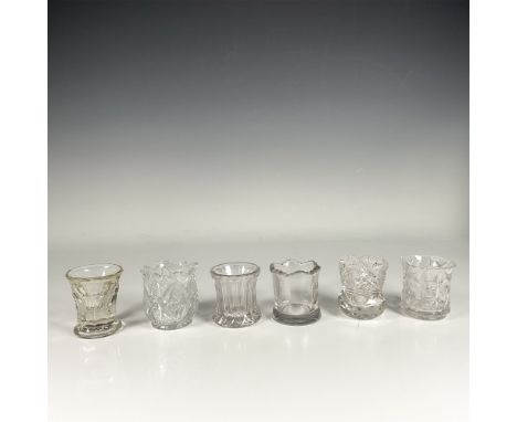 Set of six transparent glass holders, featuring various intricate glass cut designs. Dimensions of the largest item: 2.5"H x 