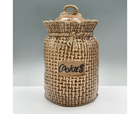 A large ceramic cookie jar forged to look like a burlap bag. It reads cookies across the front. Marked McCoy 158. Issued: 197