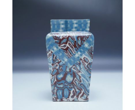 A striking contemporary studio art pottery vase with a geometric form and intricate marbled glaze in shades of blue and brown
