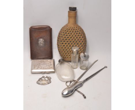 A large collection of items of white metal, silver and glass. To include silver handled button hook, hallmark worn, a white m