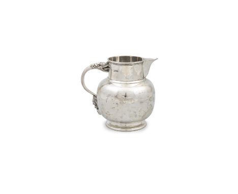 A SILVER ARTS AND CRAFTS STYLE BALUSTER SHAPED WATER PITCHER London c. 1912, markers mark rubbed, with handled cast in the fo