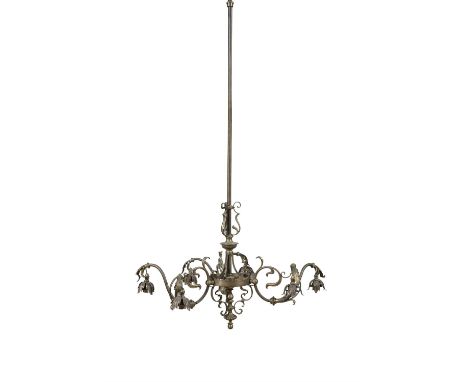 AN EDWARDIAN BRASS SIX-LIGHT ELECTROLIERthe three scroll arms each fitted with pairs of leaf cast light sockets to a central 
