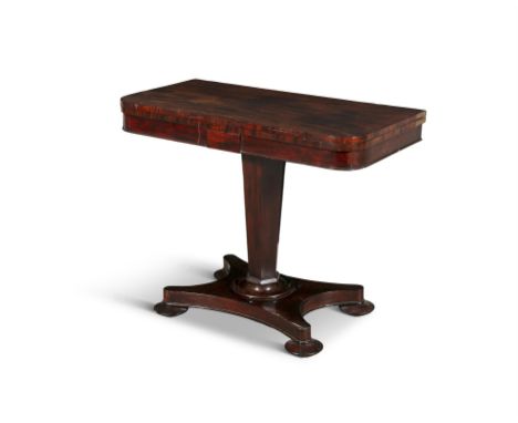 A GEORGE IV MAHOGANY FOLDING TOP TABLE,the rectangular top with rounded corners, raised on hexagonal centre pillar, on concav