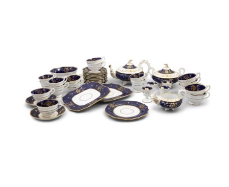 AN ENGLISH PORCELAIN BLUE AND GILT DECORATED TEA SERVICE,comprising: - a tea pot - a sugar bowl - creamer - bowl - 11 teacups