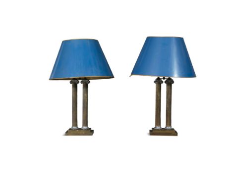 A PAIR OF BRASS TWIN PILLAR IONIC COLUMN TABLE LAMPSeach fitted with double light sockets fitted columns on stepped plinth ba