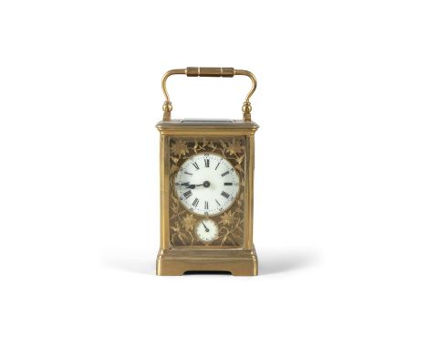 A FRENCH GILT BRASS CARRIAGE CLOCK CIRCA 1900, with raised swing handle, bevelled glass plates and lenticle, the circular ena