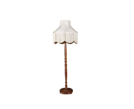 A CHINESE CARVED HARDWOOD STANDARD LAMP 20TH CENTURYfitted with white silk shade, the column carved in shallow relief on broa