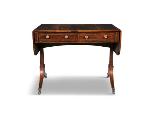 A REGENCY ROSEWOOD CROSSBANDED SOFA TABLE CIRCA 1815the rectangular top with twin drop-leaf end panels above two frieze drawe