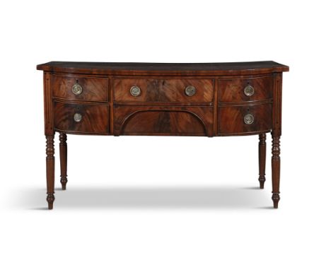 A GEORGE IV MAHOGANY BOWFRONT SIDEBOARD,the cross banded top above a long frieze drawer and recessed cutlery drawer, flanked 