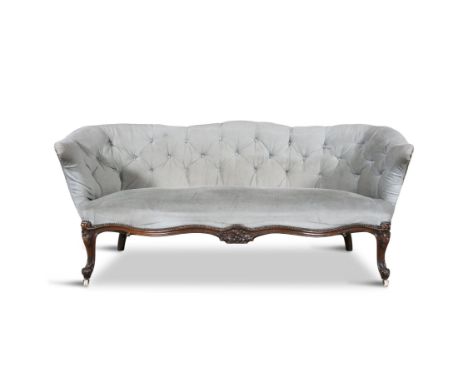 A VICTORIAN CLOSENAIL BUTTON BACK SETTEE,upholstered in light blue velvet fabric, the frame carved with stylised floral decor