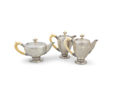 A MID-CENTURY SILVER FIVE-PIECE TEA AND COFFEE SERVICE,Sheffield 1949, mark of F.C, comprising tea, coffee and hot water pots