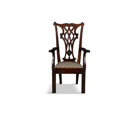 A MAHOGANY FRAMED 'CHIPPENDALE' INFANTS ARMCHAIRthe pierced vase shaped back above upholstered drop in seat out scrolling arm