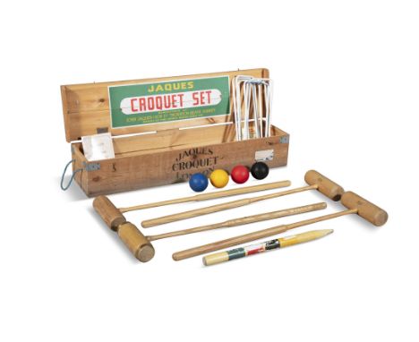 A CASED CROCQUET SET BY JAQUES OF LONDON OF THORNTON HEATH SURREYthe pine box fitted with four mallets coloured balls, ring p