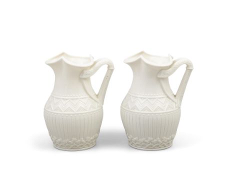 A PAIR OF BELLEK FIRST PERIOD 'HARP' JUGS with trefoil shaped rims, harp shaped handles, the baluster shaped bodies decorated