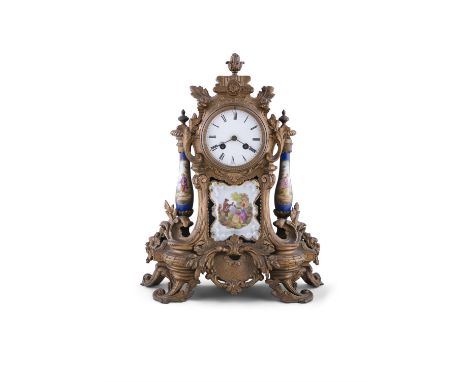 A FRENCH GILTMETAL AND PORCELAIN MOUNTED MANTLE CLOCK LATE 19TH CENTURY, cast with oak leaves and bud finial, housing a circu