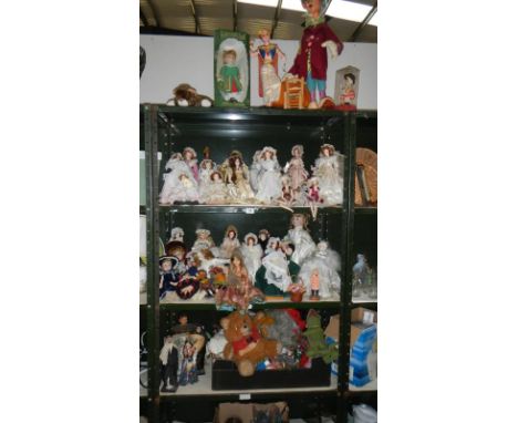 4 shelves of dolls and toys including vintage Kermit, Womble etc