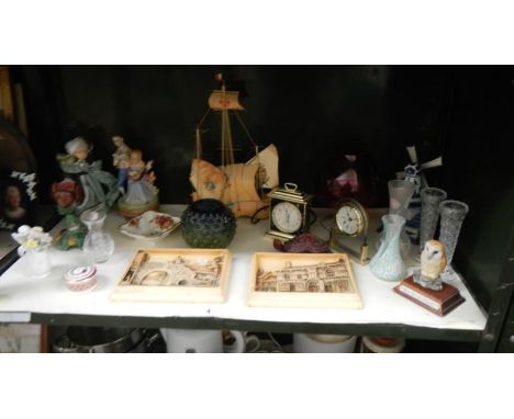 A shelf of miscellaneous including Ivorex plaques of Lincoln, figurines, clocks, glassware etc