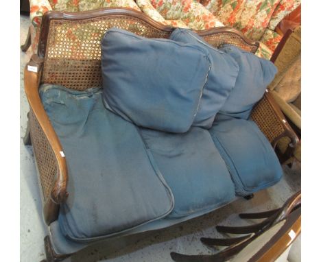 Early 20th Century mahogany double cane, three seater Bergere sofa, on cabriole legs and ball and claw feet.(B.P. 24% incl. V